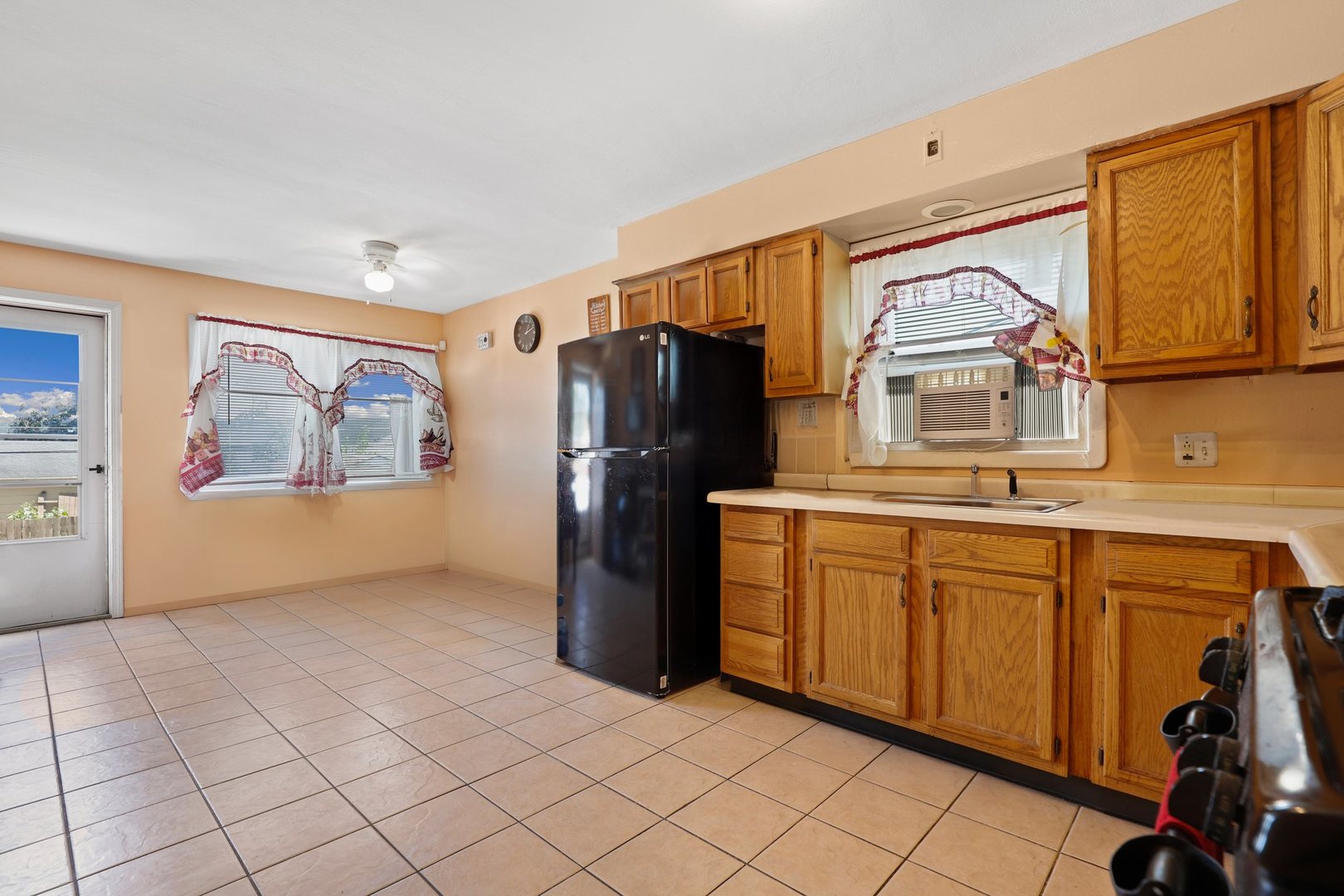 14929 Cleveland Avenue Posen, IL 60469 - Photo 11 of 23 a kitchen with stainless steel appliances granite countertop a refrigerator and a stove top oven
