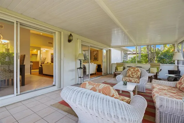 a house that has a tree in front of it