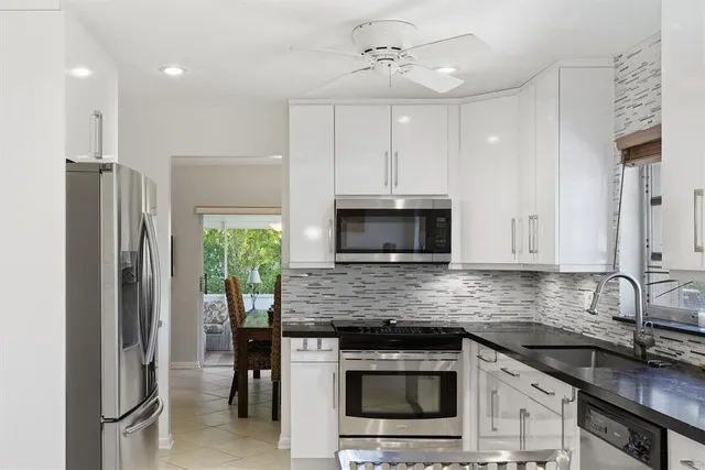 a bedroom with a bed and a lamp on table