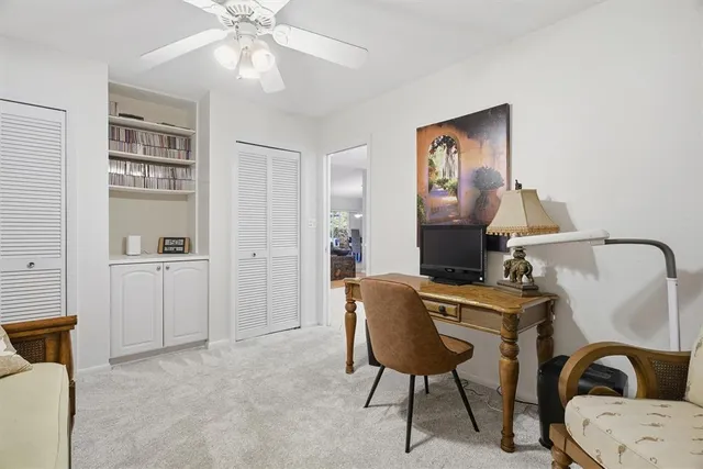 a view of a patio with a table chairs and a backyard