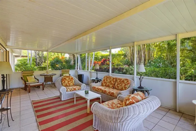 an aerial view of a residential houses with city view