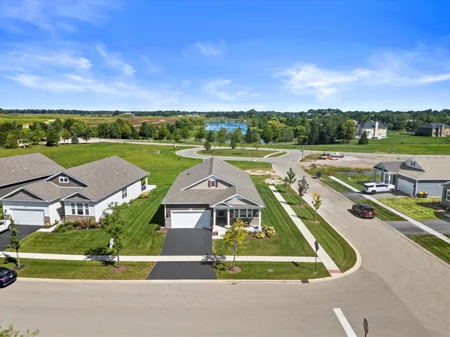 an aerial view of a house with a big yard