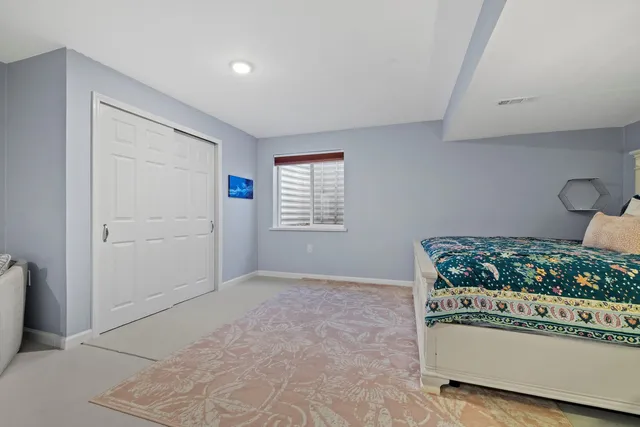 a front view of a house with a garden and plants