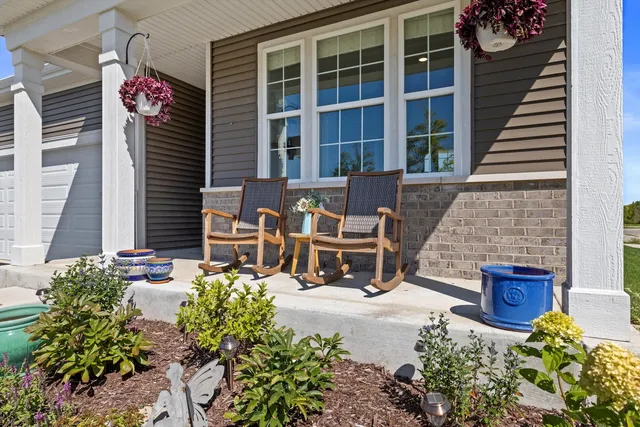 a front view of a house with a garden