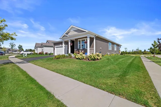 a view of a house with backyard porch and sitting area
