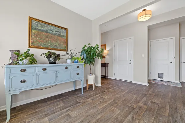 a view of an entryway with wooden floor