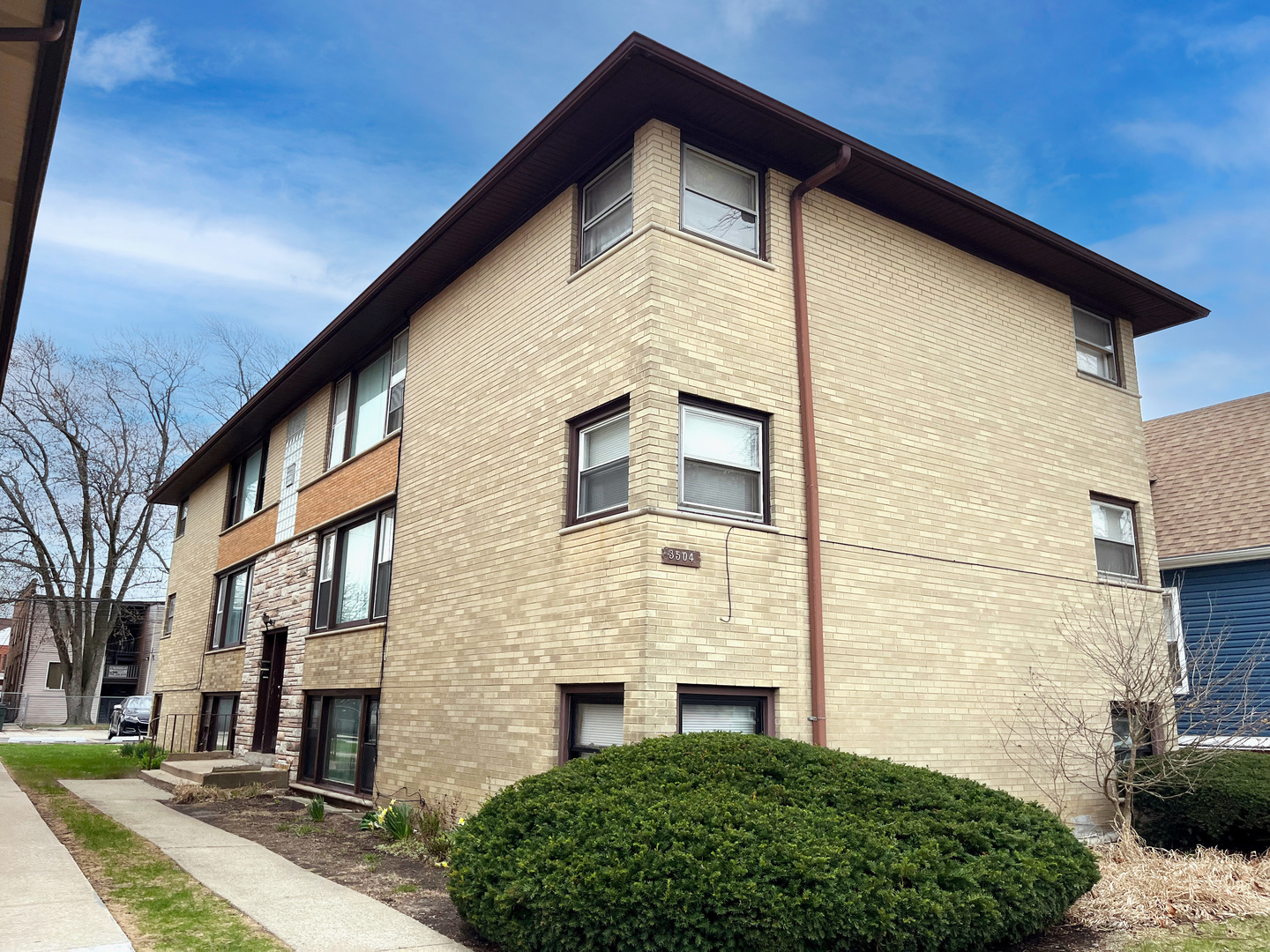 3504 Adams Street Bellwood, IL 60104 - Photo 1 of 1 a front view of a house with a garden
