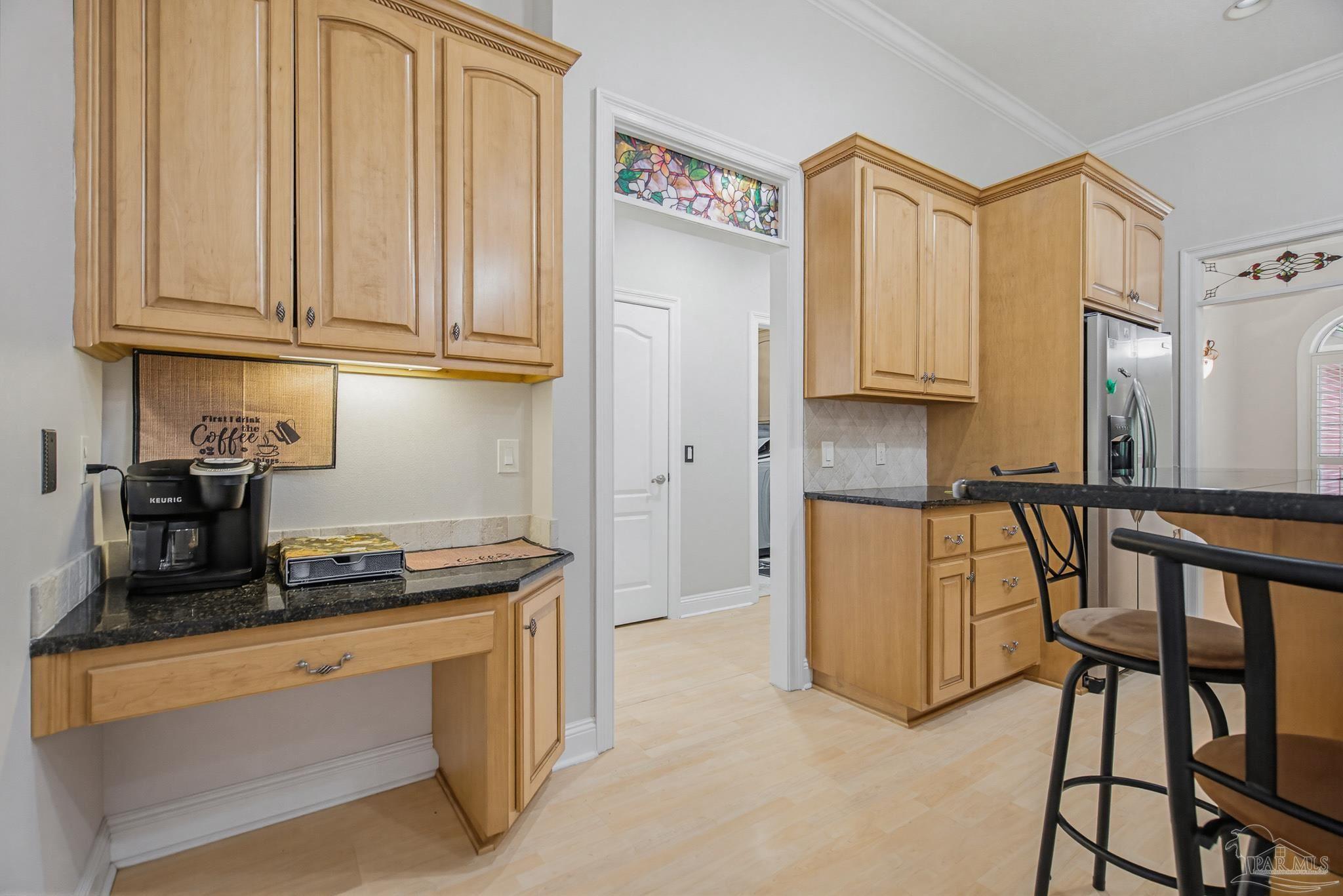 2855 Walling Road Milton, FL 32570 - Photo 19 of 55 a kitchen with stainless steel appliances granite countertop a stove a sink and a refrigerator