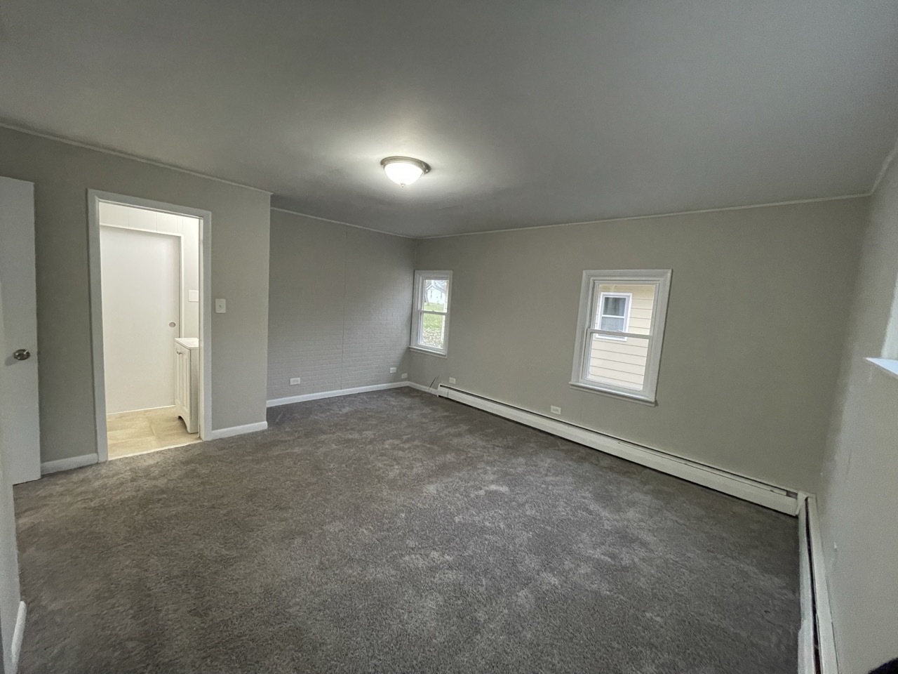 7701 Carleton Drive Spring Grove, IL 60081 - Photo 9 of 13 an empty room with windows
