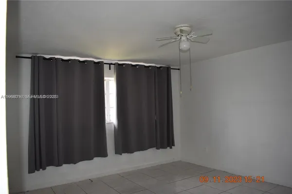 a bathroom with a shower and a toilet