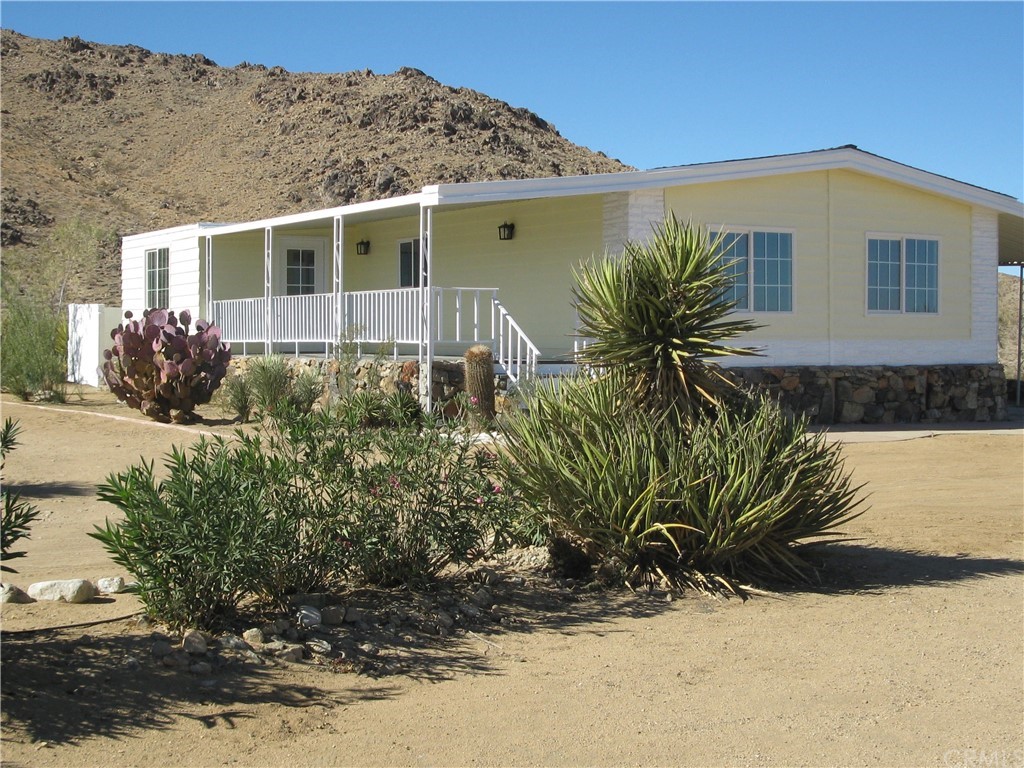 55426 Coleman Road Landers, CA 92285 - Photo 1 of 1 Front Covered Patio Deck