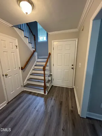 a view of entryway with stairs and wooden floor
