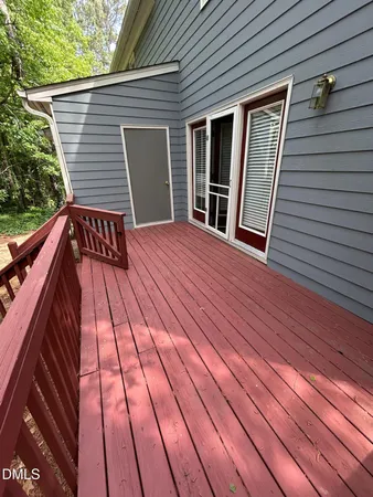 a view of outdoor space with deck and kitchen