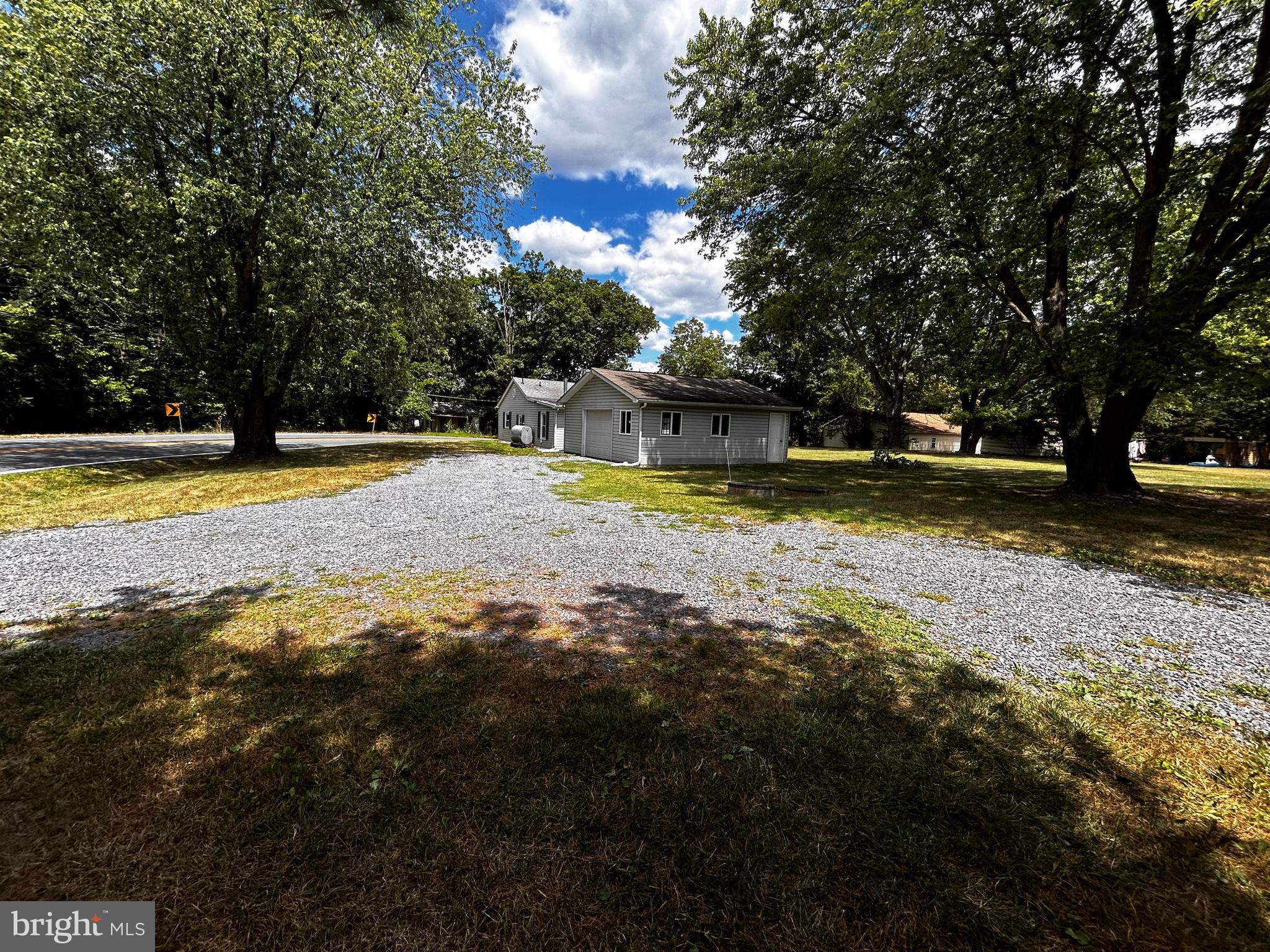 703 White Oak Road White Post, VA 22663 - Photo 2 of 23 a view of a swimming pool with an outdoor space and seating area