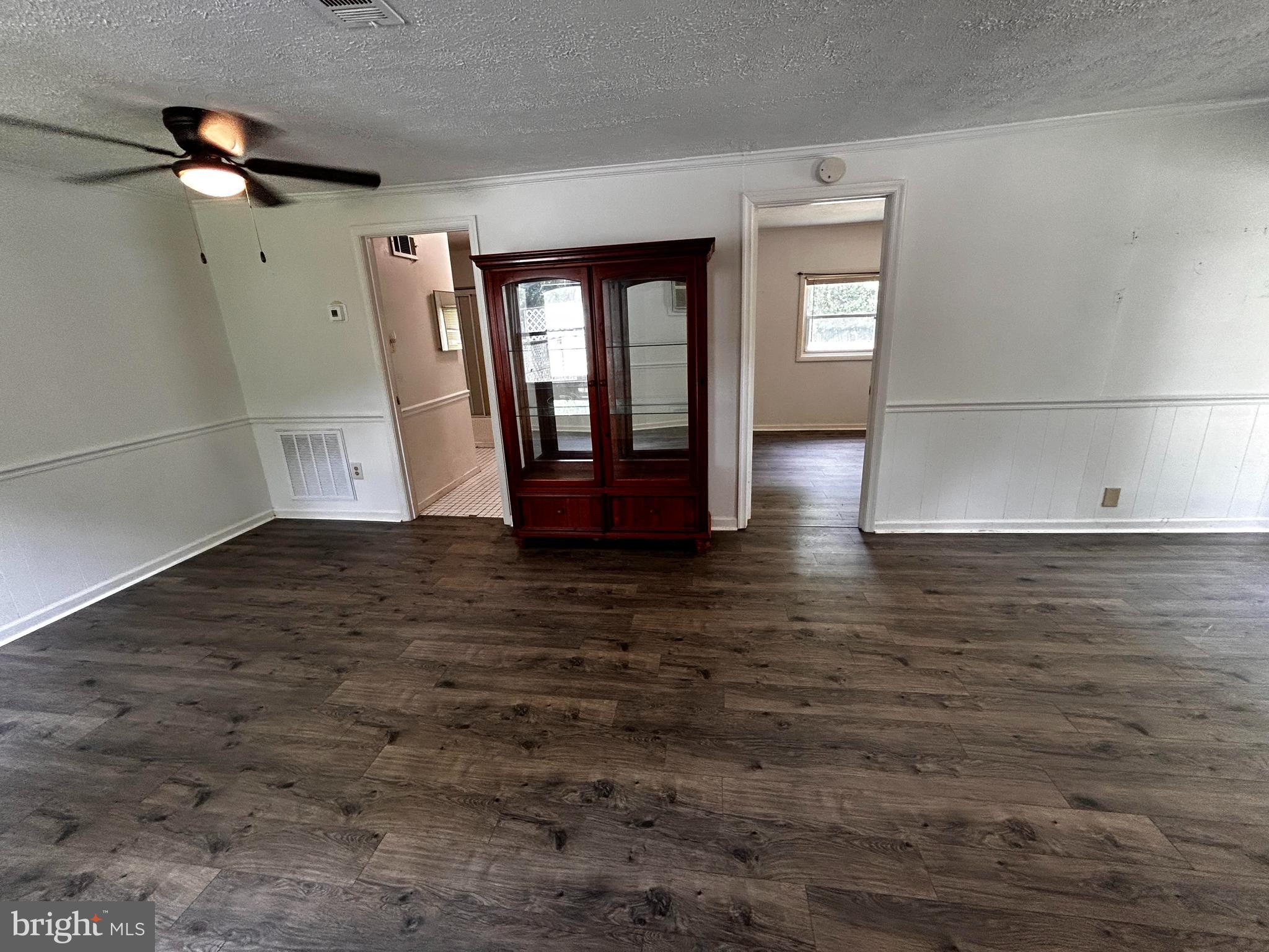 703 White Oak Road White Post, VA 22663 - Photo 5 of 23 a view of an empty room with window and wooden floor
