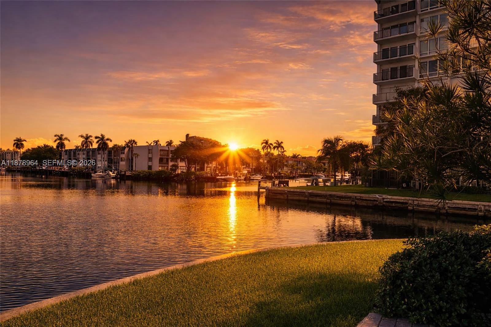 930 Southeast 9th Avenue, Unit 8 Pompano Beach, FL 33060 - Photo 2 of 26 a view of a lake with boats and trees in the background