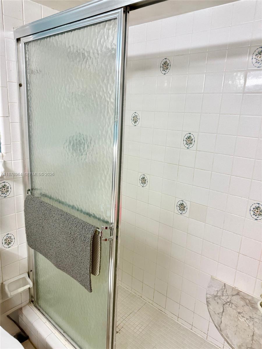 930 Southeast 9th Avenue, Unit 8 Pompano Beach, FL 33060 - Photo 23 of 26 a bathroom with a shower