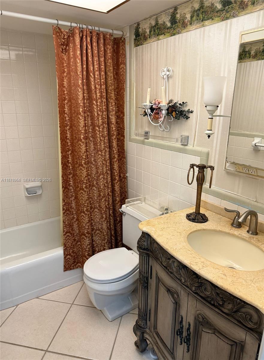 930 Southeast 9th Avenue, Unit 8 Pompano Beach, FL 33060 - Photo 26 of 26 a bathroom with a sink a toilet and shower