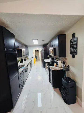 a large kitchen with lots of counter top space