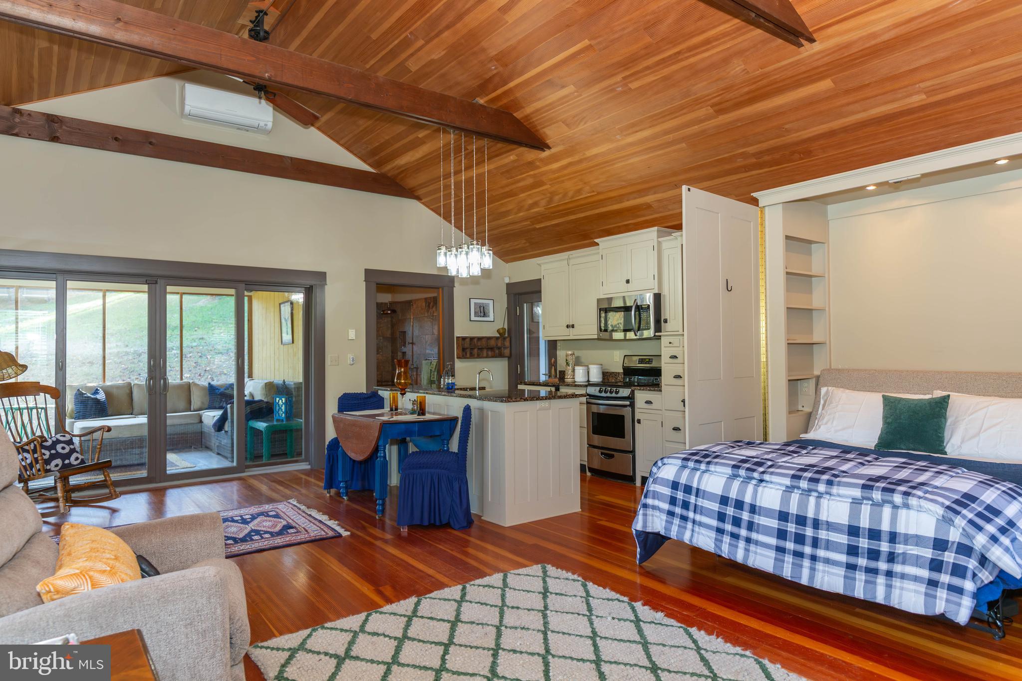 1312 John Rissler Road Charles Town, WV 25414 - Photo 10 of 24 a bedroom with furniture and large windows