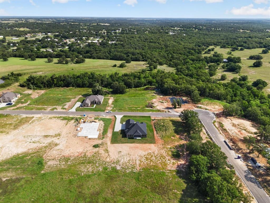 416 McAlpine Drive Springtown, TX 76082 - Photo 40 of 40 Residential development featuring a newly constructed home, additional homes under construction, and undeveloped lots
