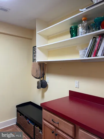 a view of room with cabinets and wooden floor
