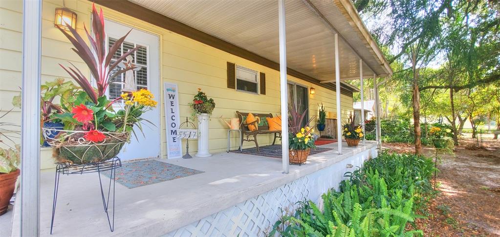 5517 County Road 579 Seffner, FL 33584 - Photo 1 of 1 a view of a bunch of flowers in a patio