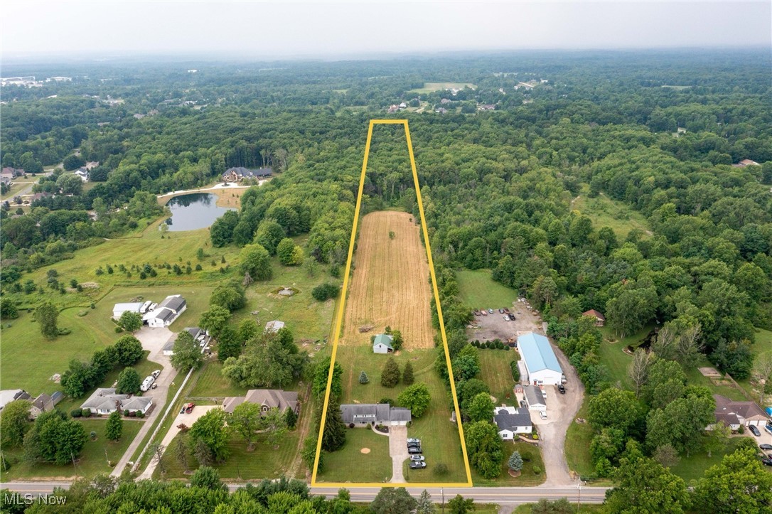 144 Substation Road Brunswick, OH 44212 - Photo 32 of 43 Aerial view of property and surrounding area featuring a forest and property parcel outlined