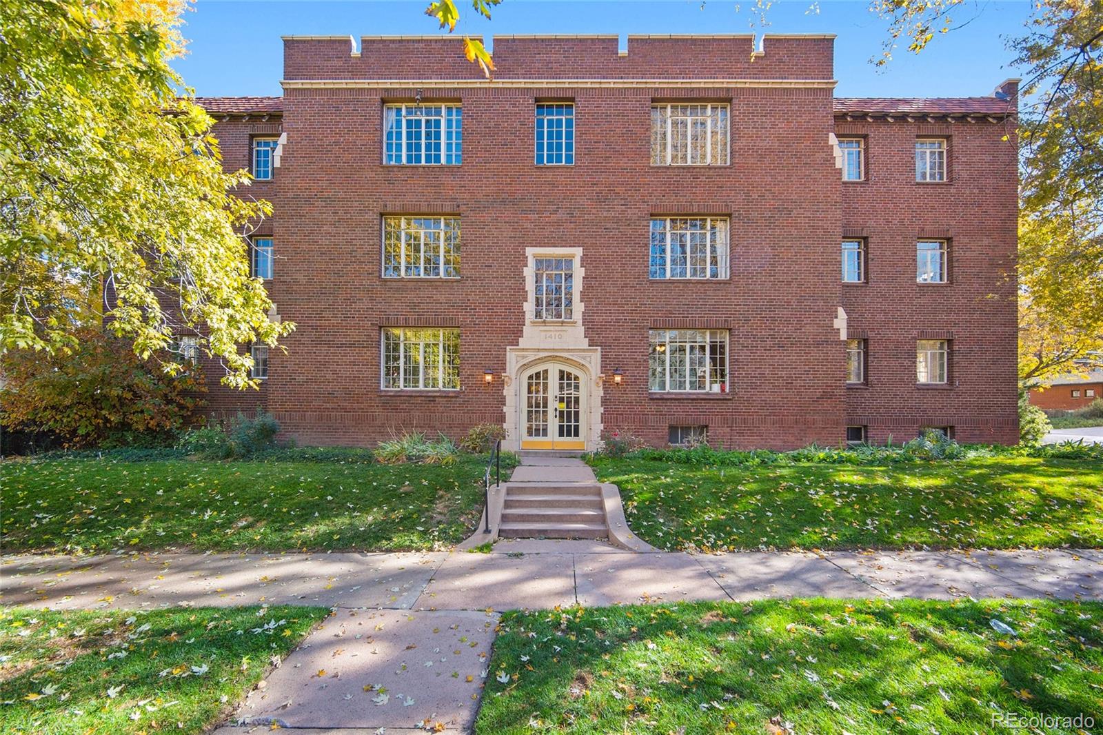 a front view of a house with yard