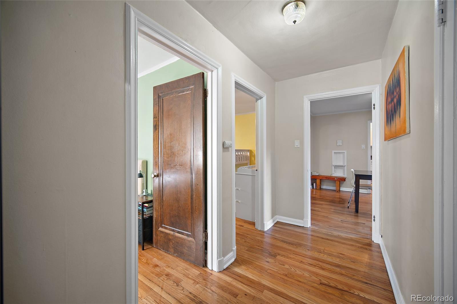 1410 Vine Street, Unit 2 Denver, CO 80206 - Photo 14 of 24 a view of a hallway with wooden floor