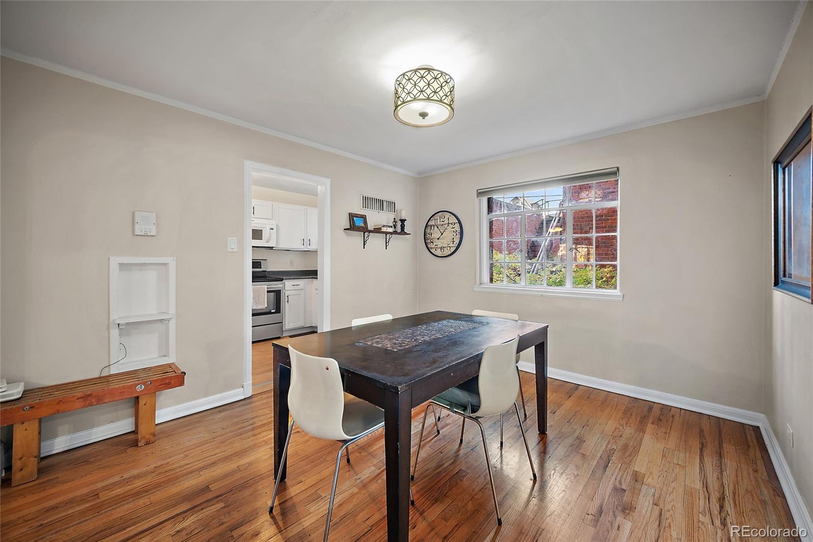 1410 Vine Street, Unit 2 Denver, CO 80206 - Photo 16 of 24 a view of a workspace with furniture and wooden floor