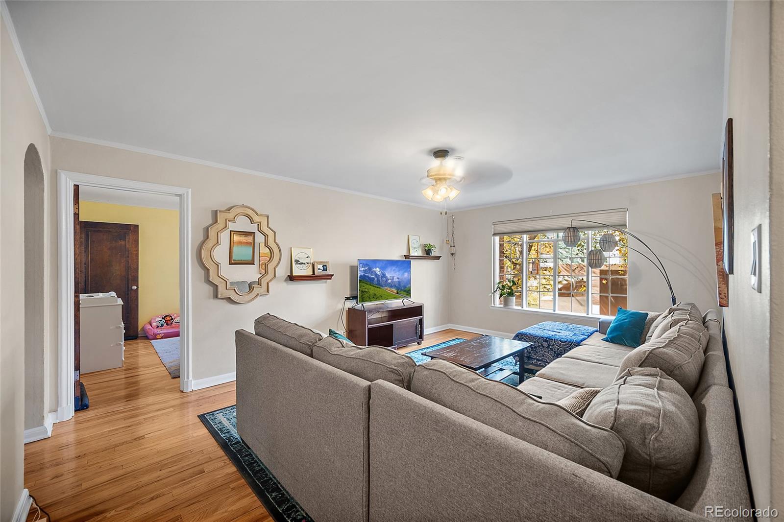 1410 Vine Street, Unit 2 Denver, CO 80206 - Photo 6 of 24 a living room with furniture and a window