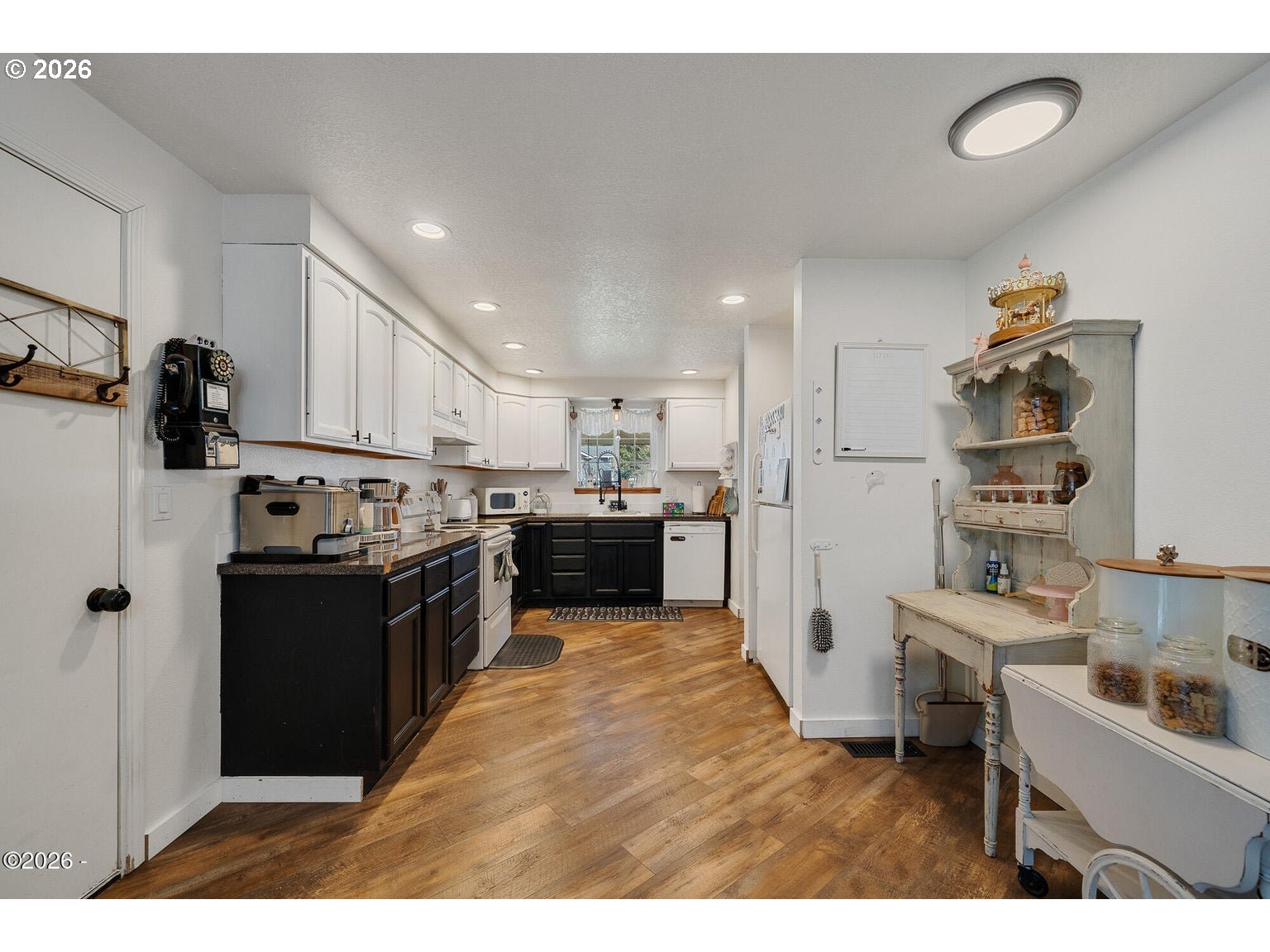 1202 North First Avenue Rockaway Beach, OR 97136 - Photo 11 of 28 a kitchen with stainless steel appliances kitchen island granite countertop a refrigerator and a sink