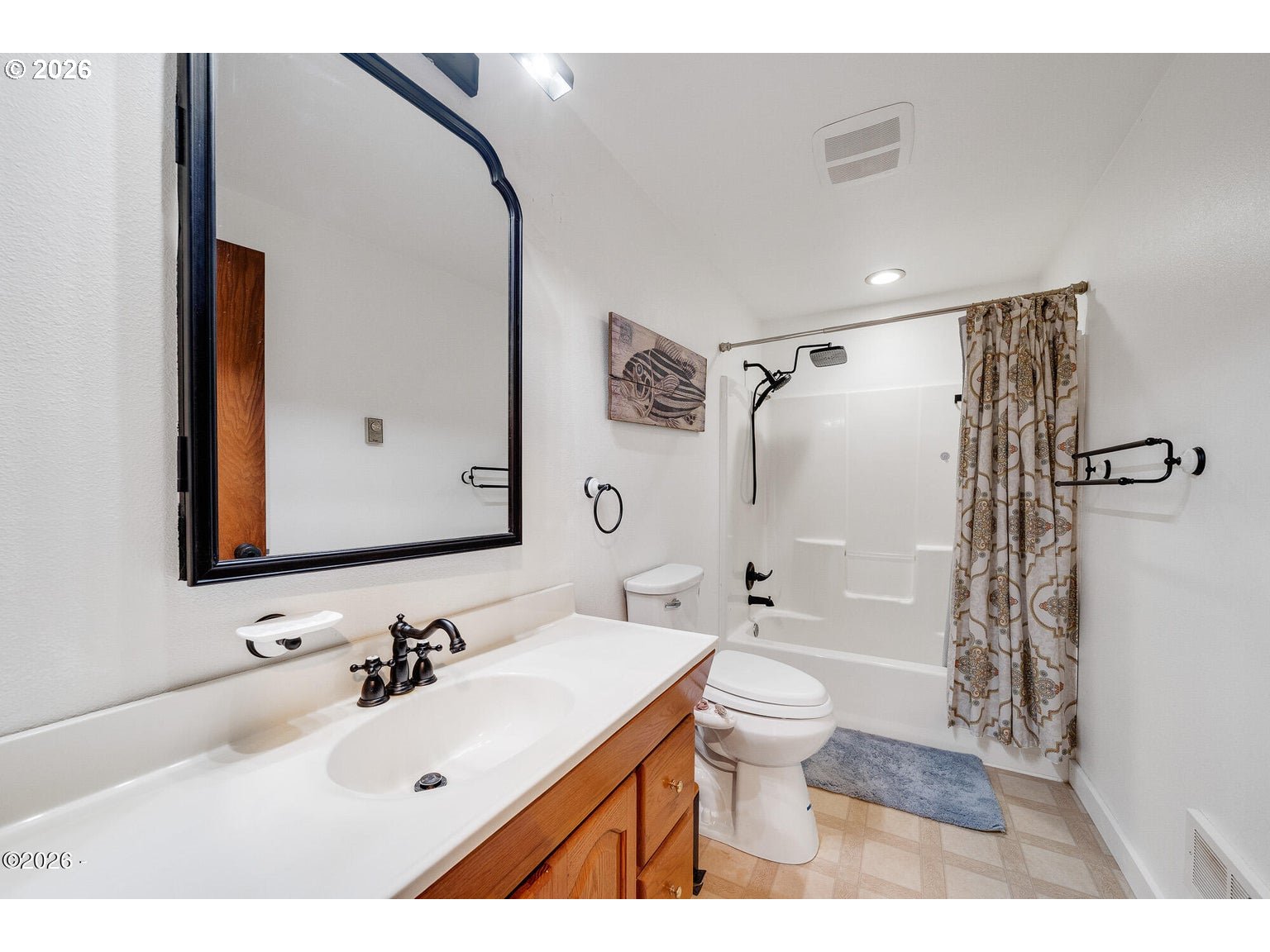 1202 North First Avenue Rockaway Beach, OR 97136 - Photo 14 of 28 a bathroom with a sink toilet tub and shower