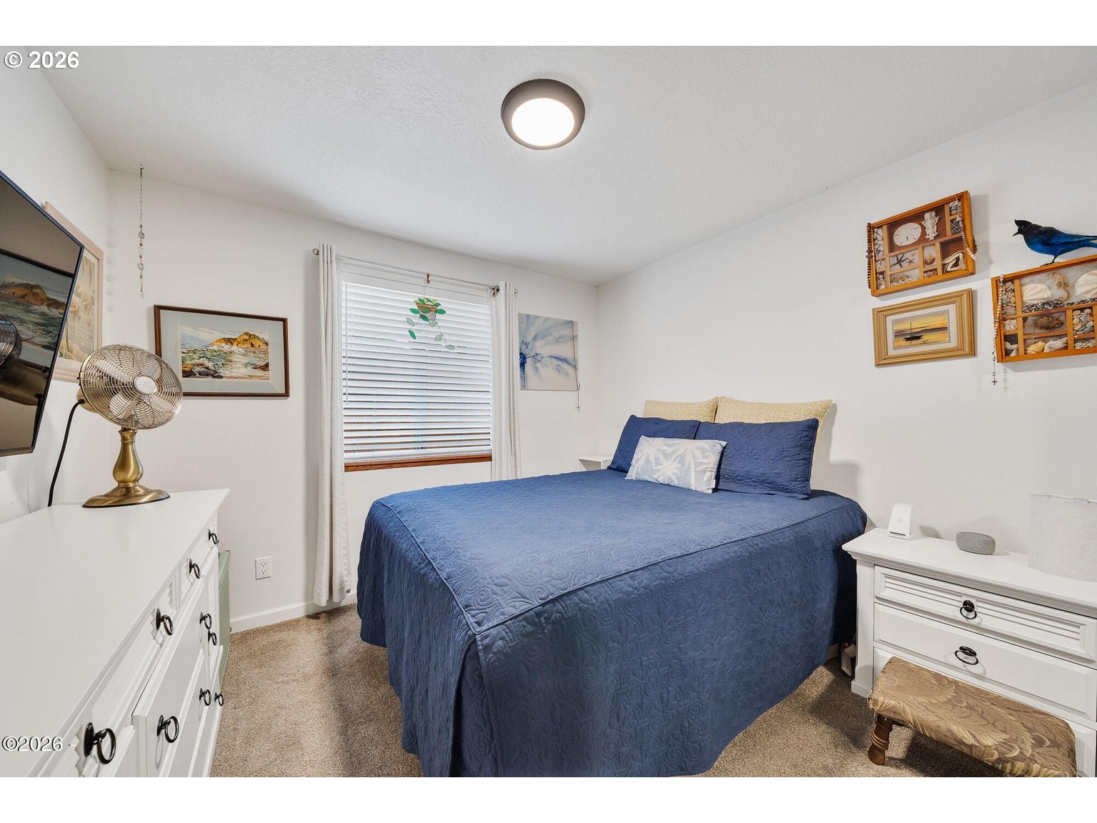 1202 North First Avenue Rockaway Beach, OR 97136 - Photo 15 of 28 a bedroom with a bed and a dresser