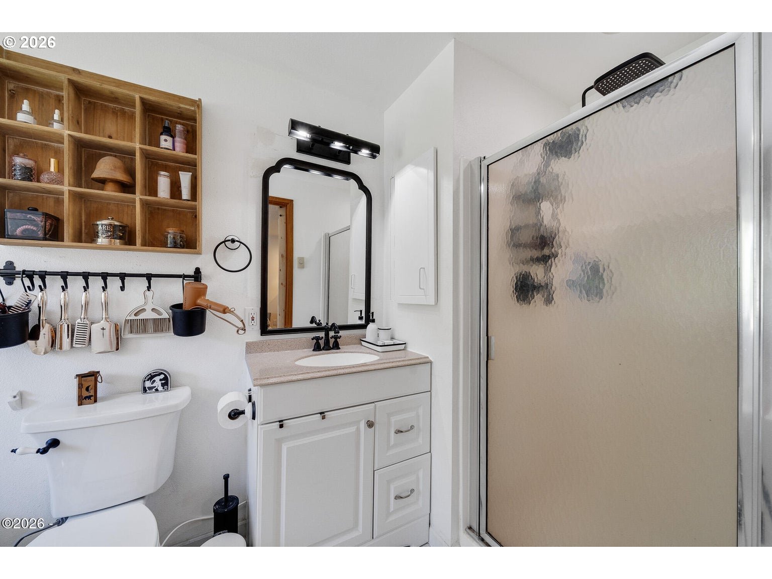 1202 North First Avenue Rockaway Beach, OR 97136 - Photo 18 of 28 a bathroom with a sink and a mirror