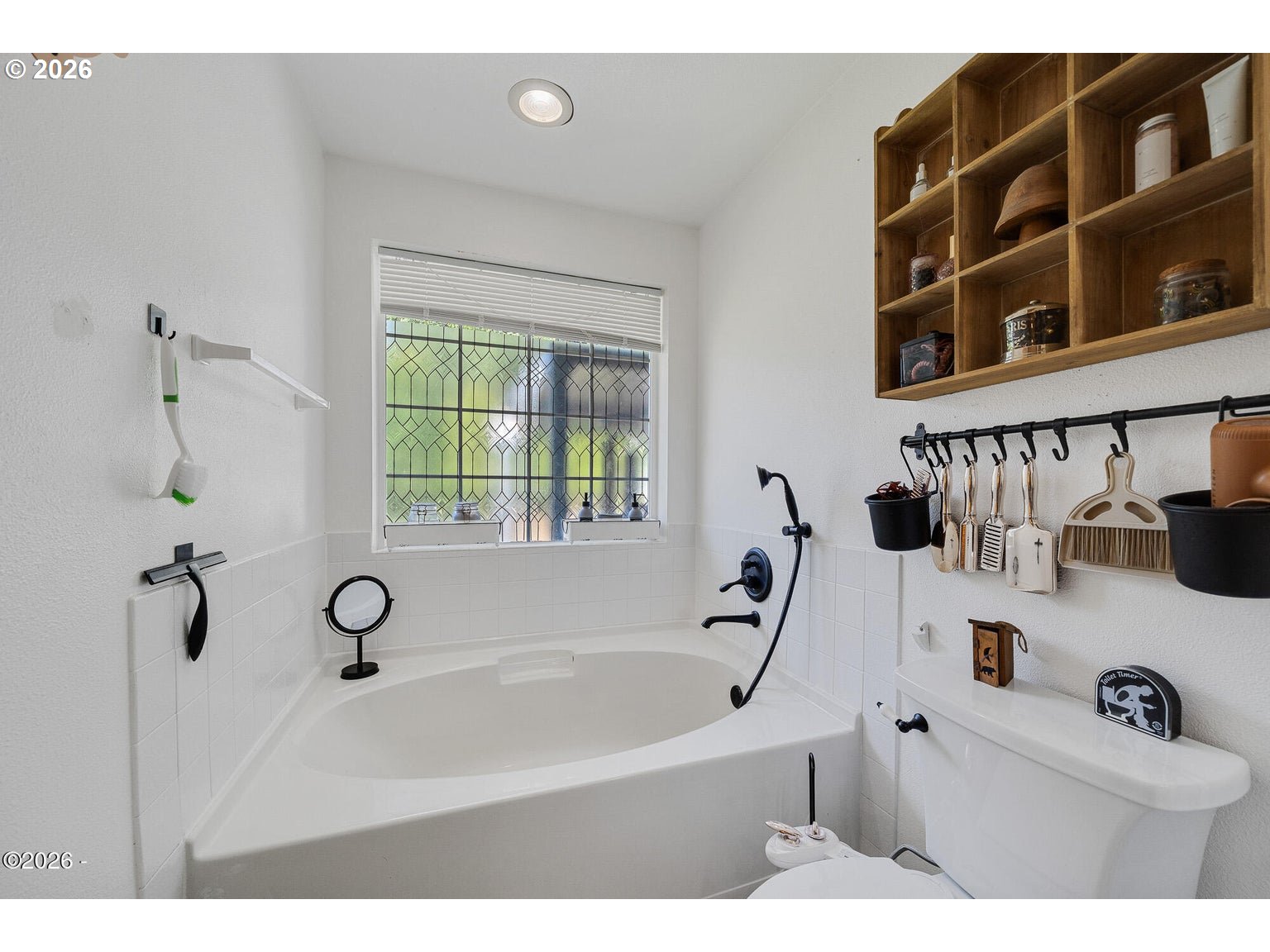 1202 North First Avenue Rockaway Beach, OR 97136 - Photo 19 of 28 a bathroom with a bathtub and a shower
