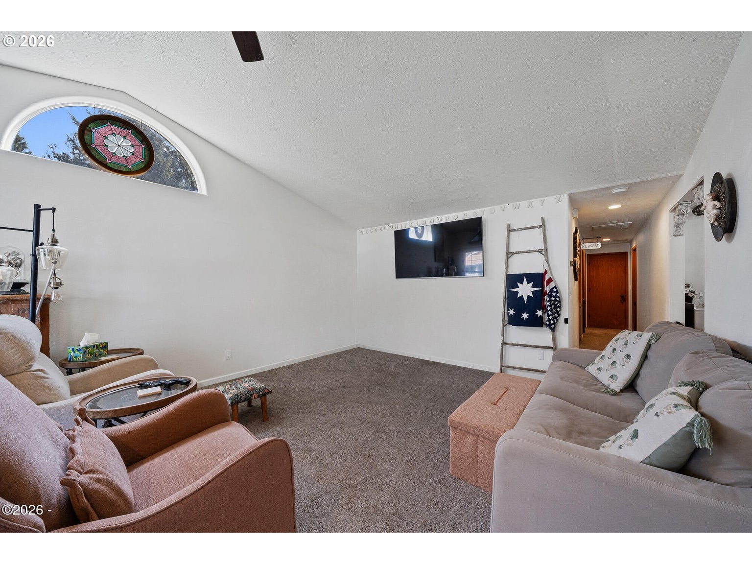 1202 North First Avenue Rockaway Beach, OR 97136 - Photo 21 of 28 a living room with furniture and a flat screen tv