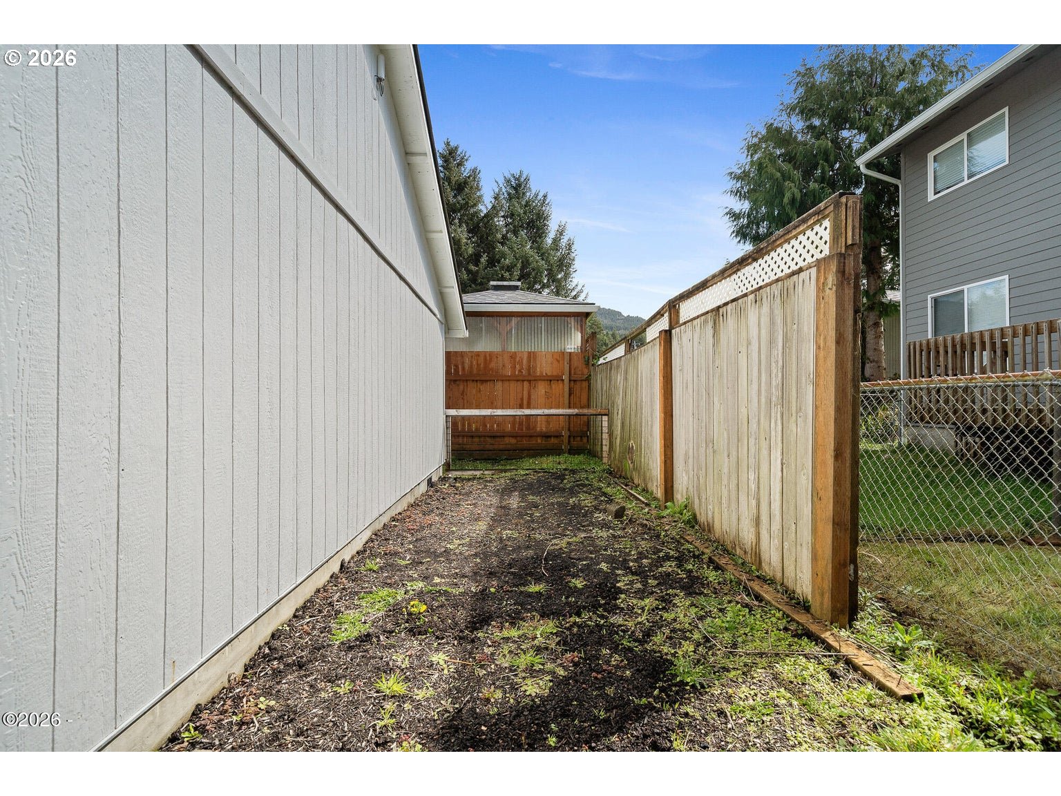 1202 North First Avenue Rockaway Beach, OR 97136 - Photo 28 of 28 a backyard of a house