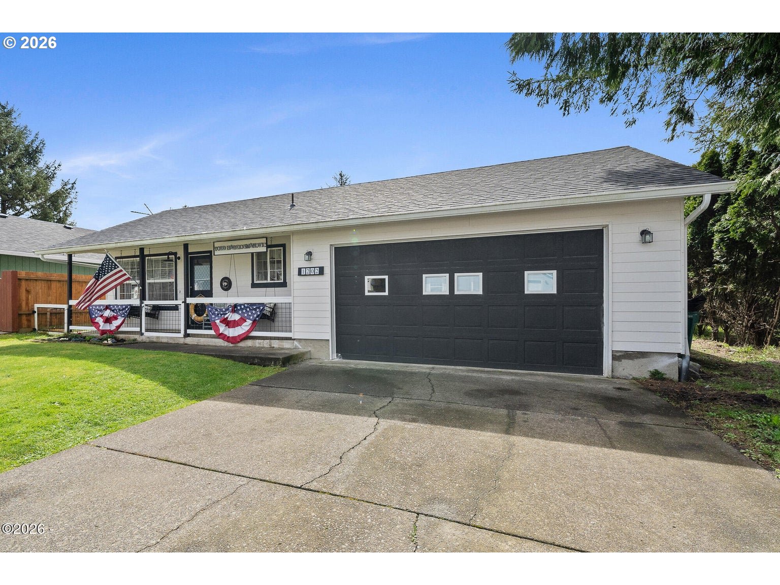 1202 North First Avenue Rockaway Beach, OR 97136 - Photo 3 of 28 a front view of a house with a yard