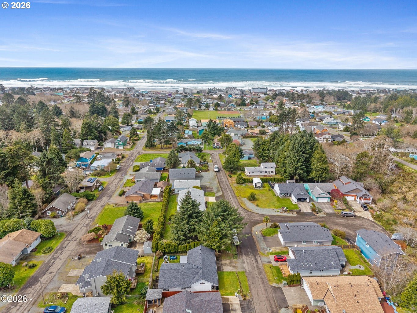 1202 North First Avenue Rockaway Beach, OR 97136 - Photo 6 of 28 an aerial view of residential houses with outdoor space