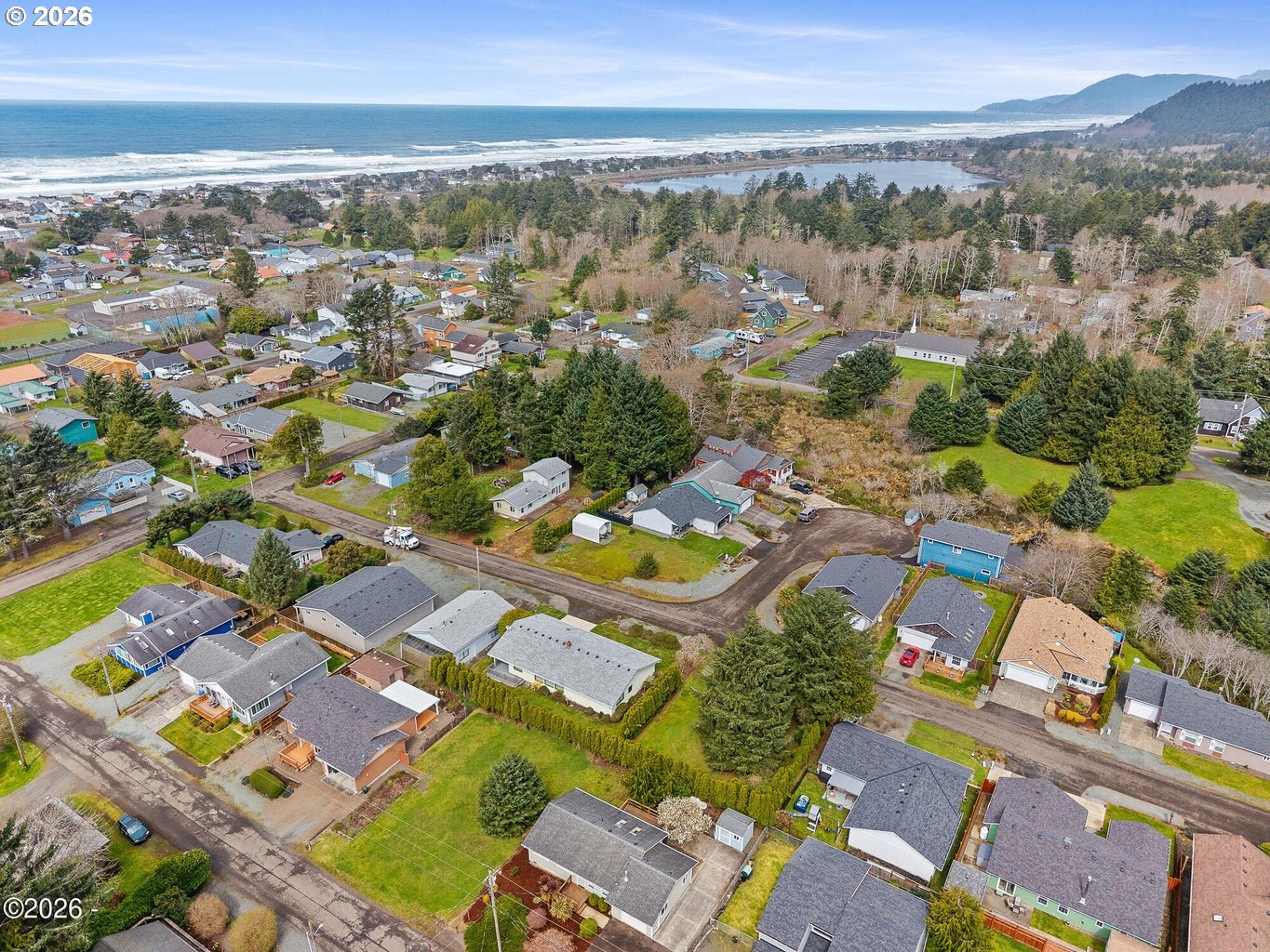 1202 North First Avenue Rockaway Beach, OR 97136 - Photo 7 of 28 an aerial view of residential houses with outdoor space