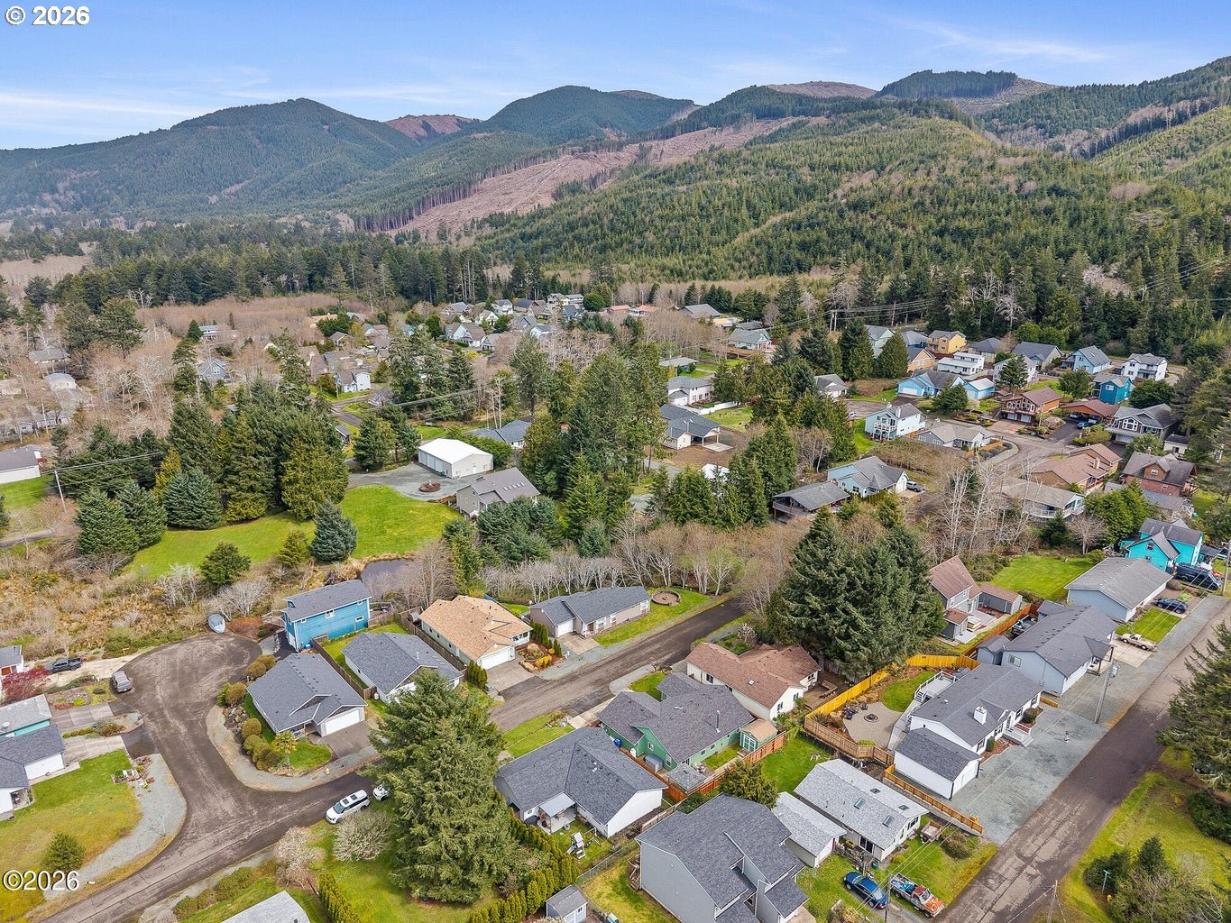 1202 North First Avenue Rockaway Beach, OR 97136 - Photo 8 of 28 an aerial view of residential house with outdoor space and mountain view