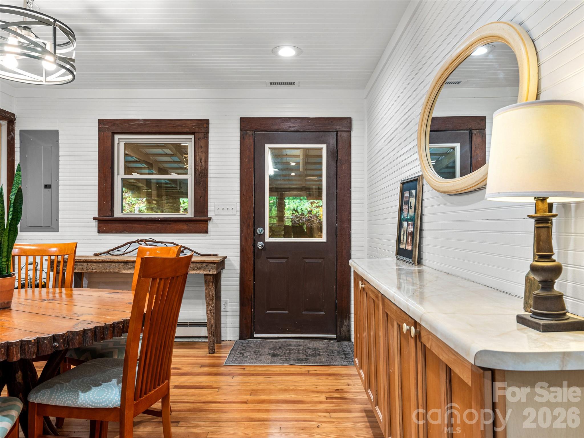 206 Chestnut Hill Road Gerton, NC 28735 - Photo 12 of 48 a front view of a house with wooden floor and furniture