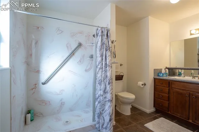 a bathroom with a shower and a toilet