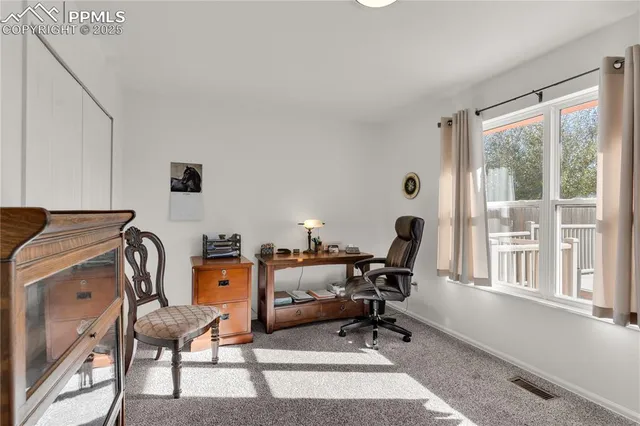 a work room with furniture and windows