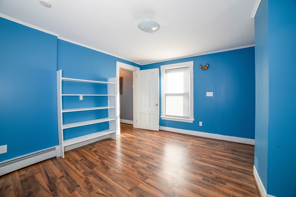 145 Center Road Dudley, MA 01571 - Photo 11 of 32 a view of room with window and wooden floor