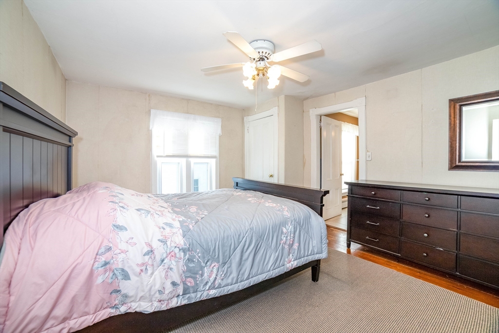 145 Center Road Dudley, MA 01571 - Photo 16 of 32 a bedroom with a bed dresser and a window