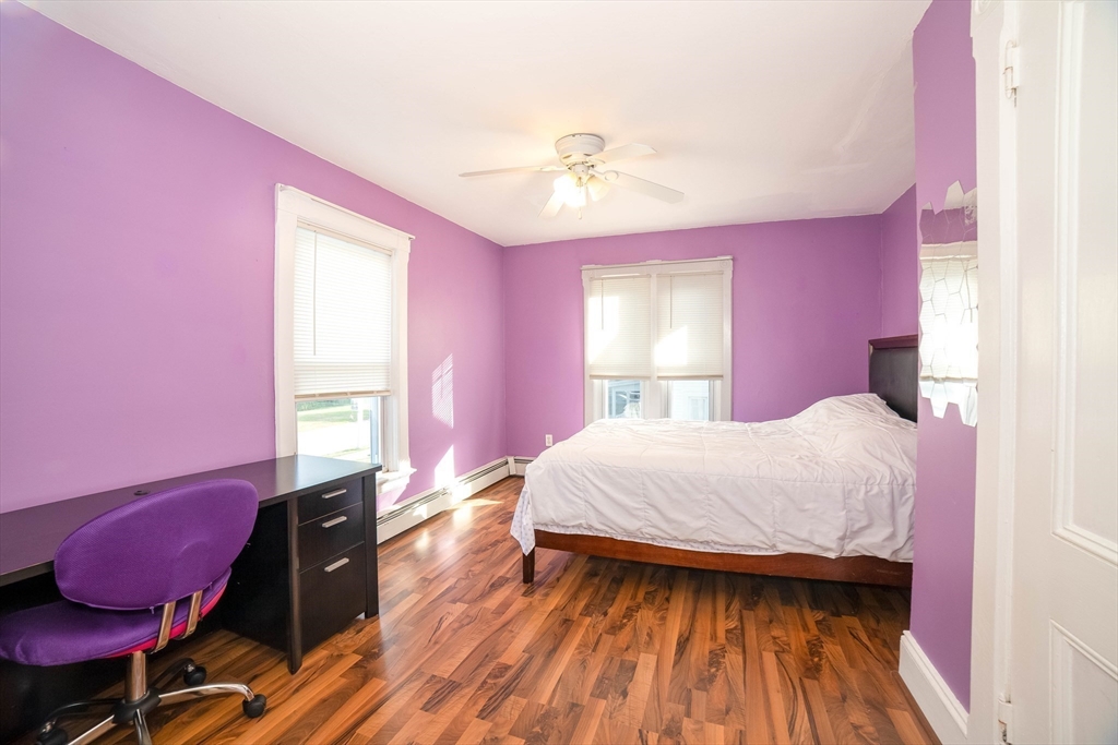 145 Center Road Dudley, MA 01571 - Photo 20 of 32 a bedroom with a bed and a mirror
