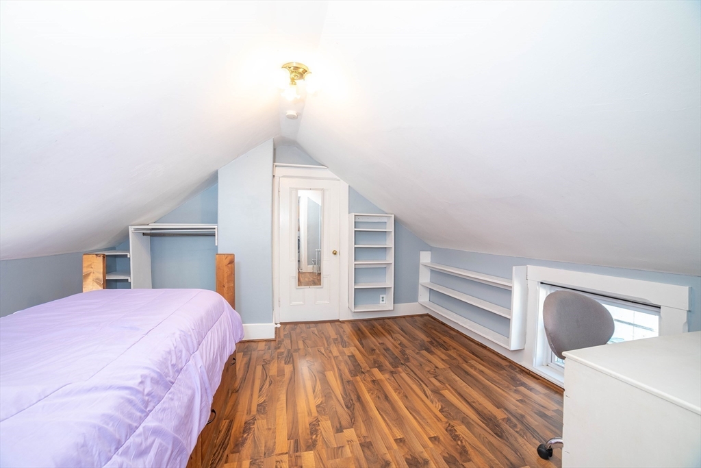 145 Center Road Dudley, MA 01571 - Photo 21 of 32 a bedroom with a bed and cabinets